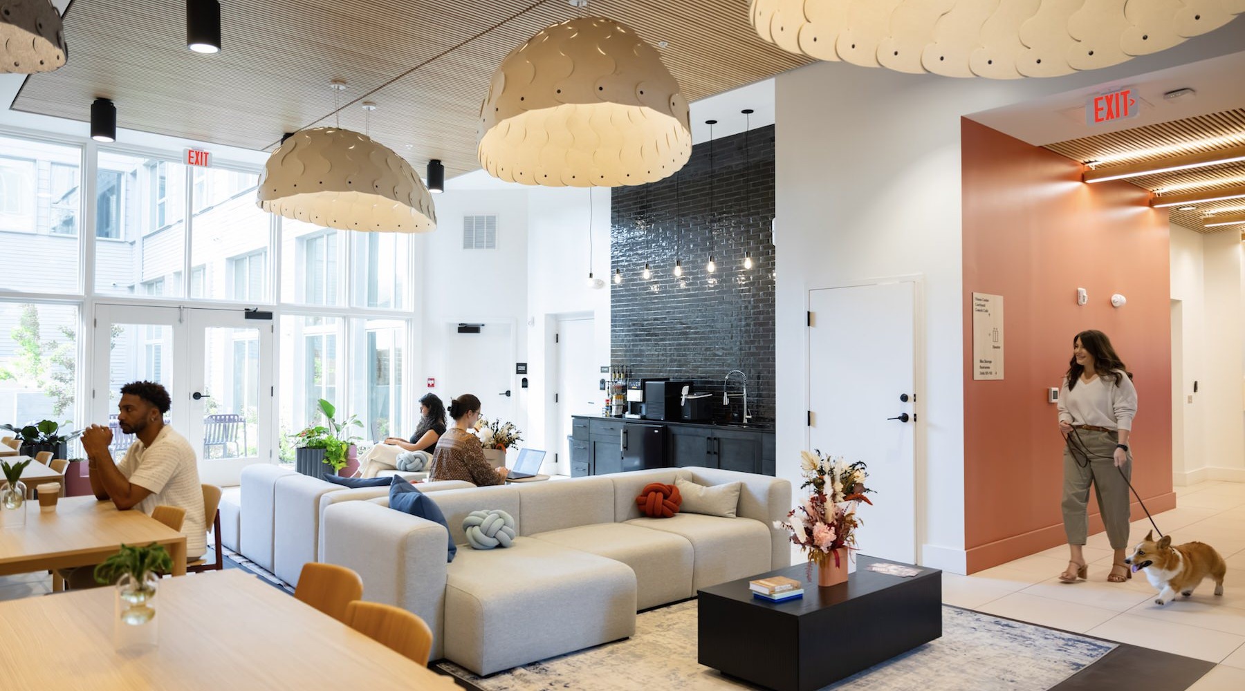 State-of-the-art amenities a clubroom with people, couches and tables